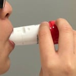 placing the mouthpiece of the turbuhaler onto the mouth