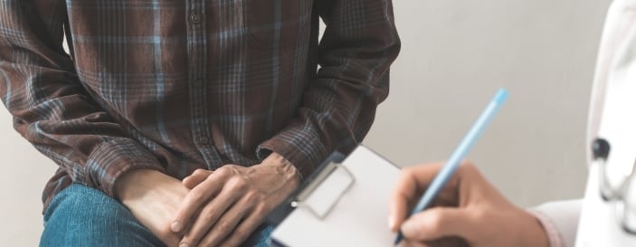 A male patient consults with a doctor about prostate cancer or some other disease A male patient consults with a doctor about prostate cancer or some other disease