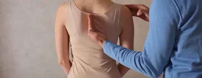 Woman having Chiropractic Back Adjustment _ Physiotherapy Treatment . Scoliosis Posture Correction for Female Patient