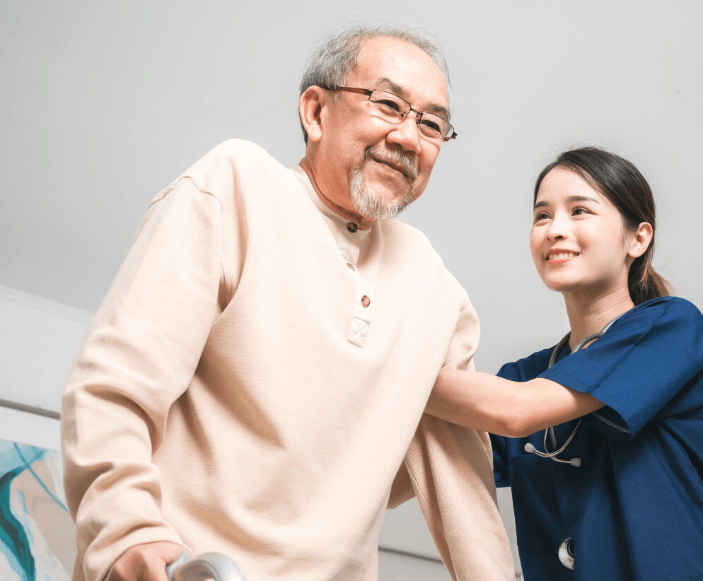 elderly patient supported by nurse