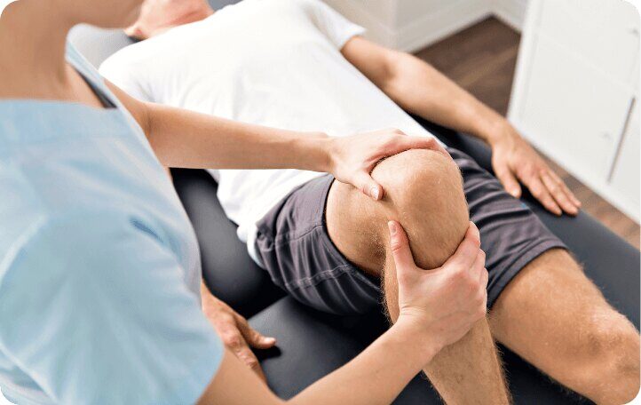 doctor working on knee