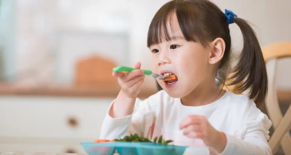 female child eating