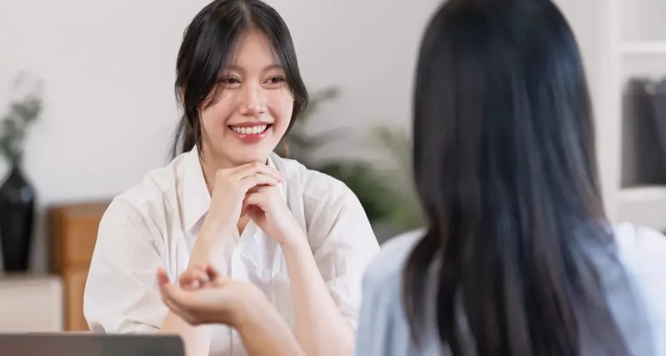 two young woman chatting
