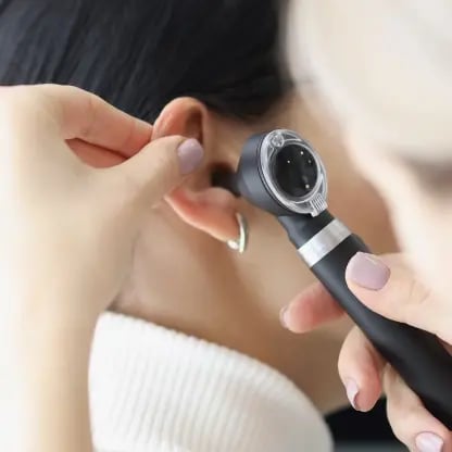 patient getting their ear checked