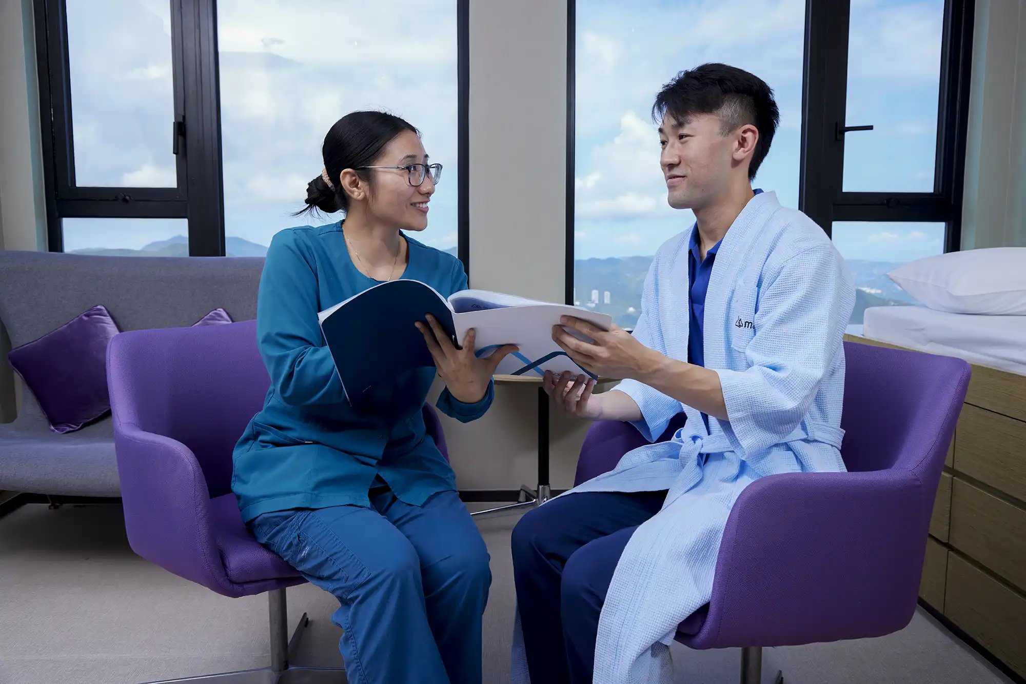 nurse explaining health check with a male patient