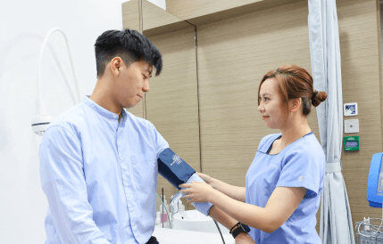 nurse measuring man's blood pressure