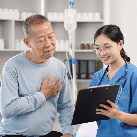 nurse showing report to elderly man