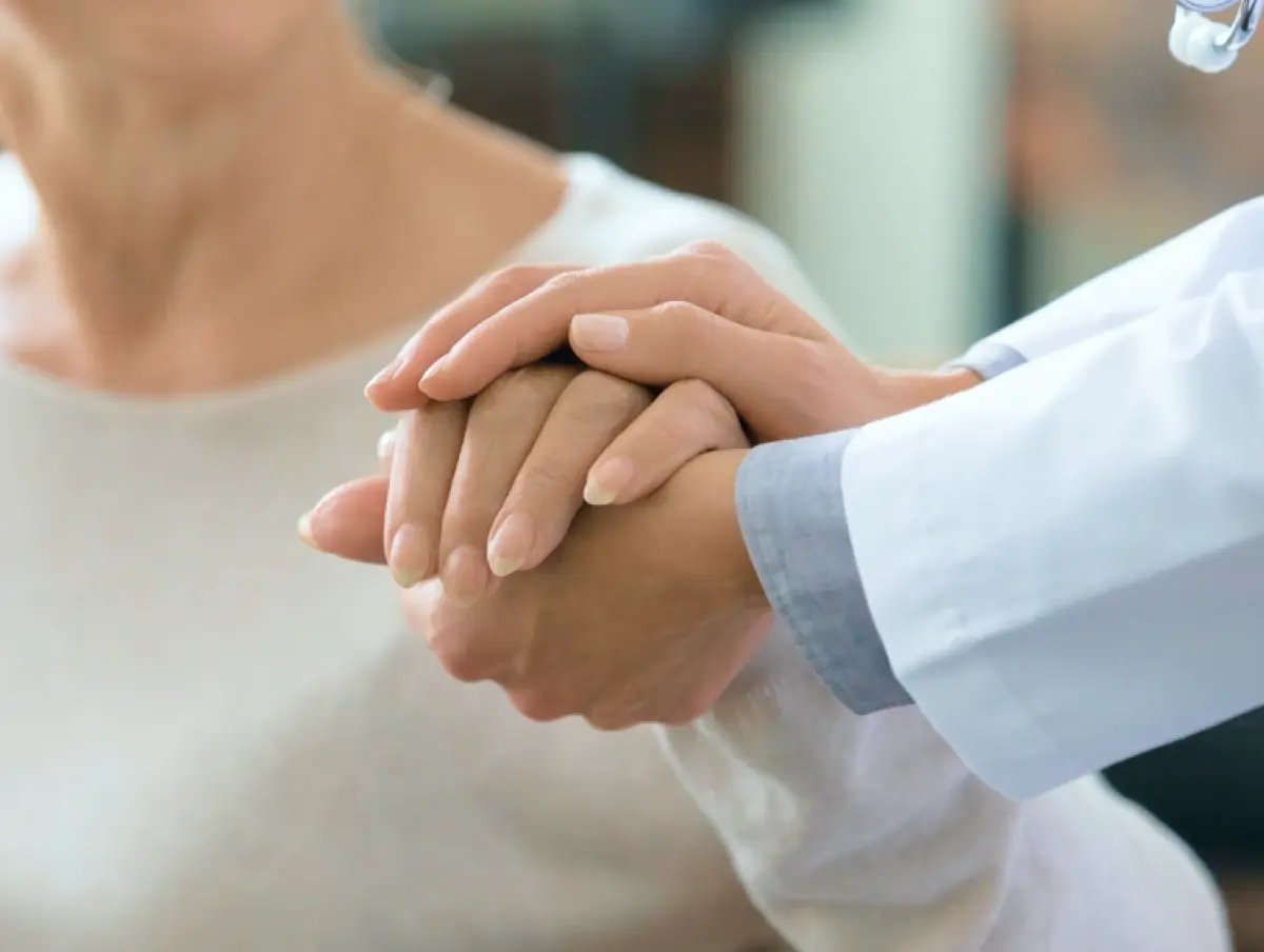 doctor guiding patient's hand