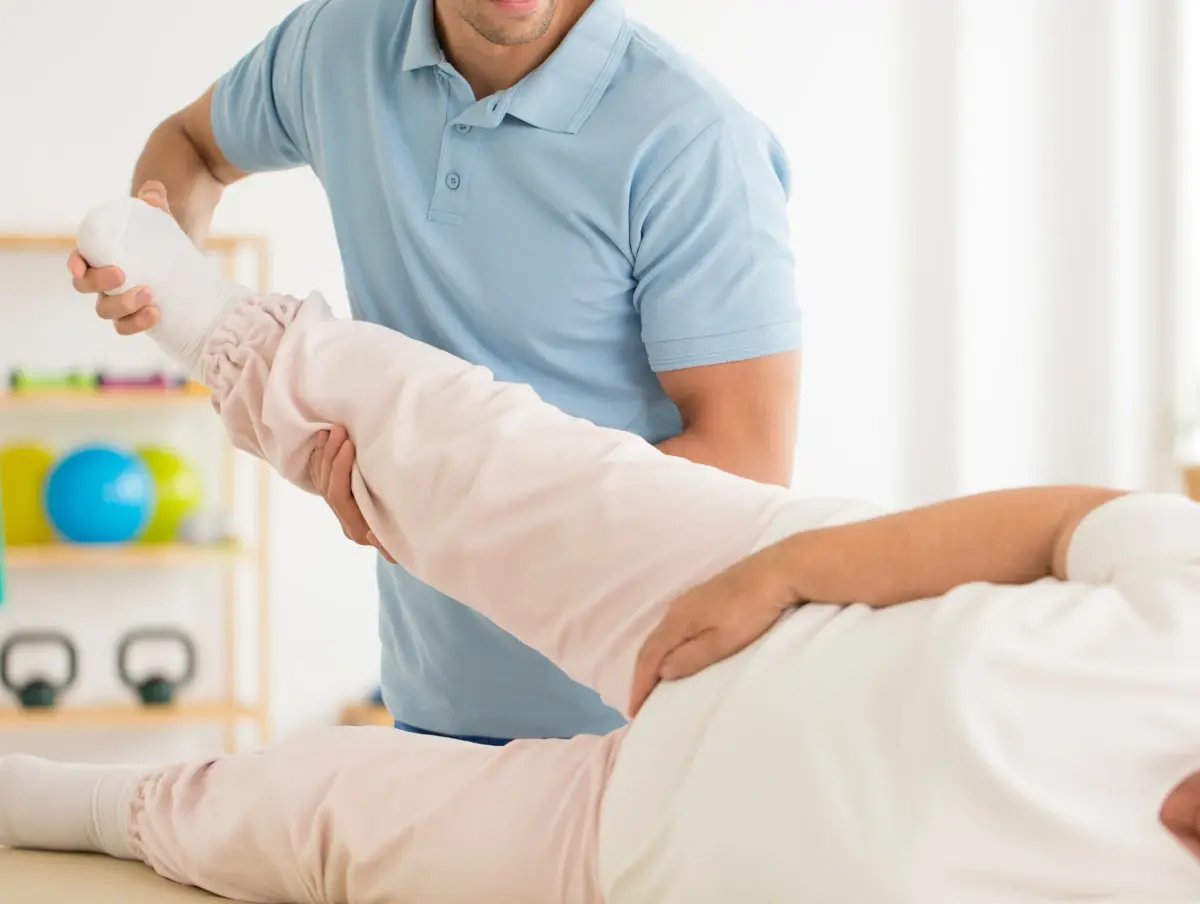 doctor adjusting hip of patients