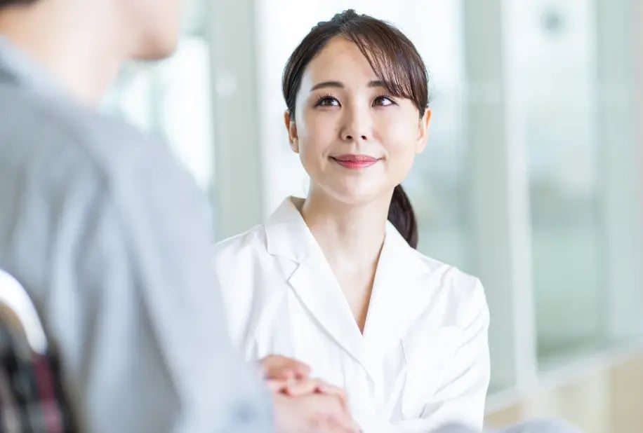 young female doctor consoling patient
