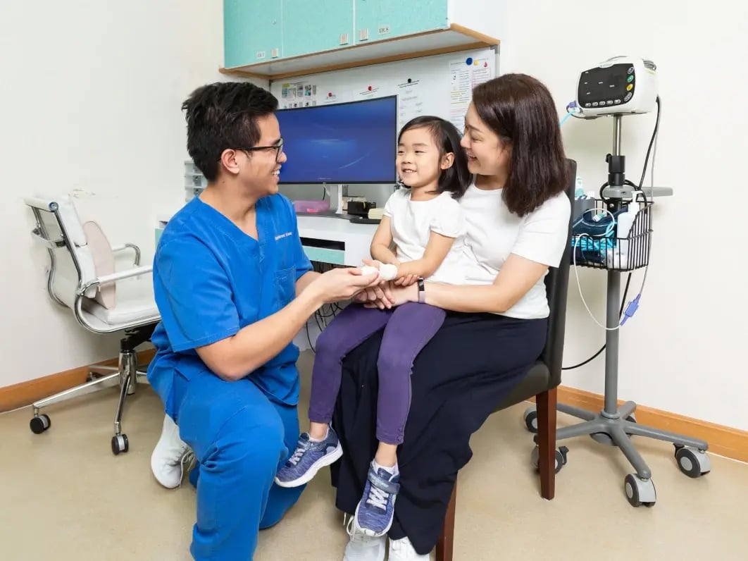 doctor treating young child