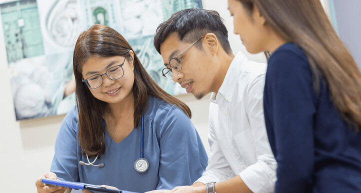 doctor walking through information with patients