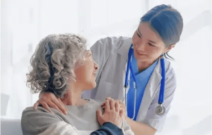 elder woman receiving care from doctor