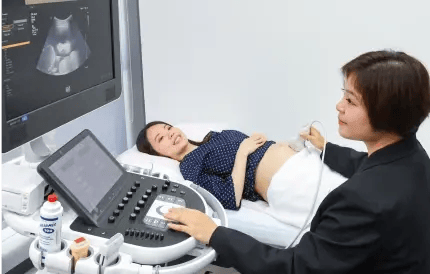 pregnant women receiving ultrasound