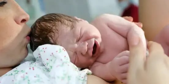 mother caring for crying baby